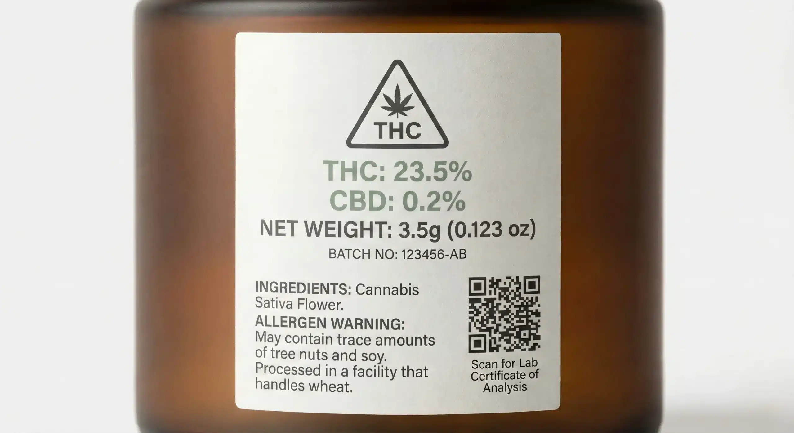 Close-up of a compliant cannabis product label with THC percentage, batch number, and QR code for lab results
